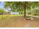 Backyard area featuring an outdoor sitting area, a fire pit, and room to roam in a parklike setting at 145 Baywood Dr, Oak Hill, FL 32759
