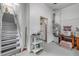 Unfinished basement area with stairs leading up and space for storage or customization at 145 Baywood Dr, Oak Hill, FL 32759