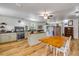 Charming kitchen with butcher block countertops, stainless appliances, wood-look flooring, and a dining area at 145 Baywood Dr, Oak Hill, FL 32759