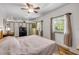 Bright main bedroom featuring wood-look floors, lots of natural light, and neutral tones at 145 Baywood Dr, Oak Hill, FL 32759