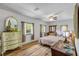 Relaxing main bedroom with wood-look floors, lots of natural light, and neutral colors throughout at 145 Baywood Dr, Oak Hill, FL 32759