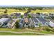 Aerial view of beautiful homes on the golf course, each with a private pool at 1539 Corolla Ct, Reunion, FL 34747