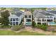 Beautiful view of a home with a private pool and outdoor seating overlooking a beautiful golf course at 1539 Corolla Ct, Reunion, FL 34747
