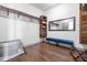 Spacious walk-in closet featuring hardwood floors, shelving, and a large mirror at 1539 Corolla Ct, Reunion, FL 34747