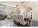 Bright dining area open to the staircase, living room and kitchen at 1539 Corolla Ct, Reunion, FL 34747