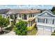 Beautiful two-story home with a clay tile roof and a well-manicured lawn and landscaping at 1539 Corolla Ct, Reunion, FL 34747
