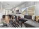 Spacious game room featuring a foosball table, pool table, seating, and large windows providing lots of natural light at 1539 Corolla Ct, Reunion, FL 34747