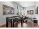 Fun game room featuring a foosball table, movie posters, and comfortable seating at 1539 Corolla Ct, Reunion, FL 34747