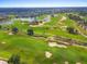 Expansive view of the meticulously maintained golf course and the surrounding homes at 1539 Corolla Ct, Reunion, FL 34747