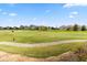 Scenic view of the golf course and surrounding homes on a sunny day at 1539 Corolla Ct, Reunion, FL 34747
