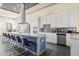Spacious kitchen featuring a large island, ample cabinetry, and modern appliances at 1539 Corolla Ct, Reunion, FL 34747