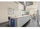 Modern open kitchen features large island, stainless appliances, and inviting atmosphere at 1539 Corolla Ct, Reunion, FL 34747