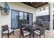 A covered outdoor dining area and outdoor kitchen provide beautiful space for entertaining at 1539 Corolla Ct, Reunion, FL 34747
