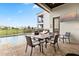 Covered outdoor dining area overlooks the pool and a manicured golf course at 1539 Corolla Ct, Reunion, FL 34747