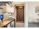 Custom wine cellar located near the staircase at 1539 Corolla Ct, Reunion, FL 34747