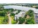 An aerial view of lakeside condo community with lush landscaping and ample parking at 1550 11Th Ne St # H-4, Winter Haven, FL 33881