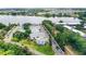 Aerial view of multi-Gathering home community showing road access, lakeside living, and ample parking at 1550 11Th Ne St # H-4, Winter Haven, FL 33881