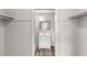 En-suite bathroom boasts wood-look flooring, vanity, toilet, and built-in shelving at 1550 11Th Ne St # H-4, Winter Haven, FL 33881