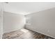 Bright bedroom features wood-look floors and a window for natural light at 1550 11Th Ne St # H-4, Winter Haven, FL 33881