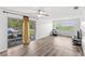 Bright living room with a sliding glass door leading to a balcony, offering natural light and outdoor views at 1550 11Th Ne St # H-4, Winter Haven, FL 33881