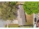 Aerial view of home showcasing its roof, the front yard, driveway, and back yard at 1563 Dess Dr, Orlando, FL 32818