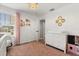Bedroom featuring a plush rug, changing table dresser and an elegant chandelier at 1563 Dess Dr, Orlando, FL 32818