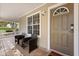 Welcoming front porch with seating area, perfect for enjoying quiet moments by the front door at 1563 Dess Dr, Orlando, FL 32818