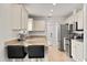 Bright and clean kitchen with stainless steel appliances, sleek countertops, and ample storage at 1563 Dess Dr, Orlando, FL 32818