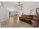 Spacious living area with dining space, a leather sofa, and an open floor plan at 1563 Dess Dr, Orlando, FL 32818