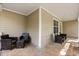 Covered outdoor patio with multiple seating arrangements perfect for outdoor entertaining at 1563 Dess Dr, Orlando, FL 32818