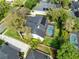 A lovely home featuring a private pool and solar panels, as seen from an aerial perspective at 1682 Wingspan Way, Winter Springs, FL 32708