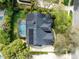 Aerial view of a well-maintained home with a pool and lush landscaping in a desirable neighborhood at 1682 Wingspan Way, Winter Springs, FL 32708