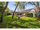 Spacious backyard featuring a fire pit and swings, offering plenty of space for outdoor activities at 1682 Wingspan Way, Winter Springs, FL 32708