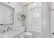Bright bathroom features marble countertop, modern fixtures, and a shower-tub combination with white tile surround at 1682 Wingspan Way, Winter Springs, FL 32708