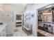 Hallway leading to the primary bathroom with a walk-in closet and shower at 1682 Wingspan Way, Winter Springs, FL 32708