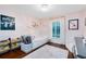 Cozy ' bedroom with pink accents, a wooden floor, and natural lighting at 1682 Wingspan Way, Winter Springs, FL 32708