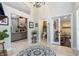 Lovely foyer with an attractive view into the Gathering room with its floor-to-ceiling fireplace and a view to the play room at 1682 Wingspan Way, Winter Springs, FL 32708