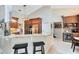 Spacious kitchen featuring granite countertops, stainless steel appliances and a breakfast nook with a wine fridge at 1682 Wingspan Way, Winter Springs, FL 32708