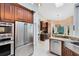 Gleaming kitchen with stainless steel appliances and granite countertops with a breakfast nook in the background at 1682 Wingspan Way, Winter Springs, FL 32708