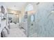 Spa-like bathroom with a glass-enclosed shower, soaking tub, and elegant fixtures at 1682 Wingspan Way, Winter Springs, FL 32708