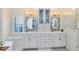 Bathroom featuring double vanity sinks, modern cabinetry, and marble countertops at 1682 Wingspan Way, Winter Springs, FL 32708