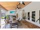 Spacious covered patio offers outdoor dining space, tv, and stylish decor, perfect for entertaining and relaxing at 1682 Wingspan Way, Winter Springs, FL 32708