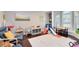 Bright playroom featuring a hardwood floor, large windows and toys at 1682 Wingspan Way, Winter Springs, FL 32708