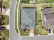 Overhead view of a neatly landscaped property featuring a lush lawn, walkway, and well-maintained surroundings at 16936 Champlain St, Clermont, FL 34714