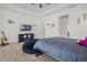 Spacious bedroom with a large window and a comfortable beanbag chair near the platform bed at 16936 Champlain St, Clermont, FL 34714