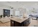 Spacious kitchen with large island opens up to the living and play areas, perfect for hosting friends and Gathering at 16936 Champlain St, Clermont, FL 34714