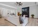 Living room showcases a neutral color palette, sleek tile flooring, and a modern fireplace at 16936 Champlain St, Clermont, FL 34714