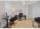 Bright office space with wood-look flooring and space for two desks, great for working from home at 16936 Champlain St, Clermont, FL 34714
