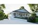 Charming single-story home with a welcoming front porch and well-manicured landscaping at 1727 Barrow St, Deltona, FL 32725