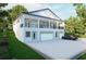Elegant two-story home with a spacious three-car garage and lush green lawn at 1727 Barrow St, Deltona, FL 32725